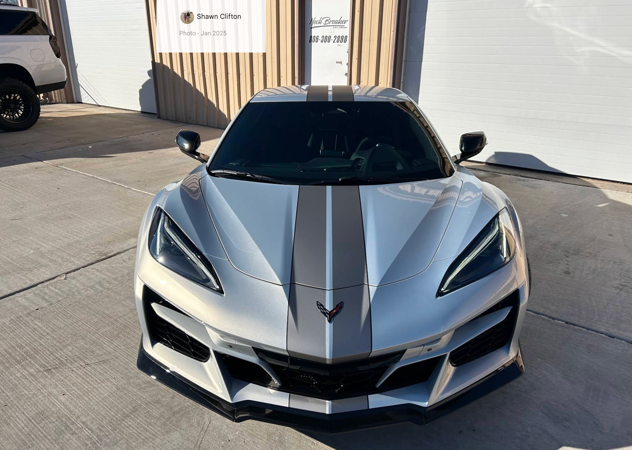 White Corvette with racing stripes wrapped by Neck Breaker Vinyl Co